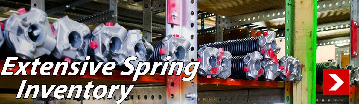 Extensive Spring Inventory image shows torsion springs on a rack.
